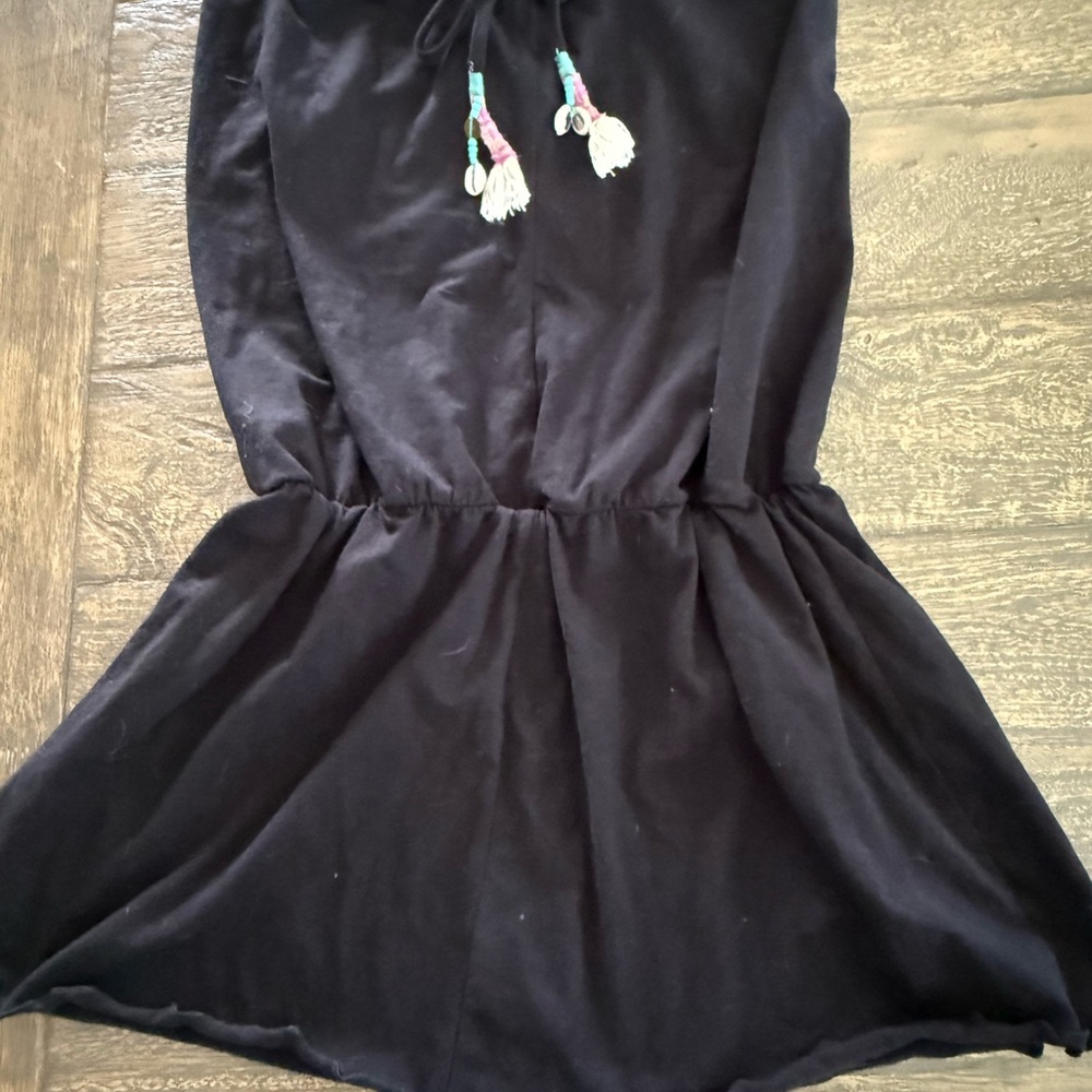 Black strapless pull up casual mini dress with tassels. Size small. Never worn.